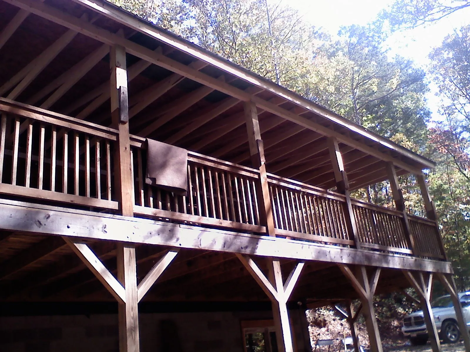 Timber framing under a new elevated porch and deck — Roof Leak Repair in Coralville by Roofing Brothers